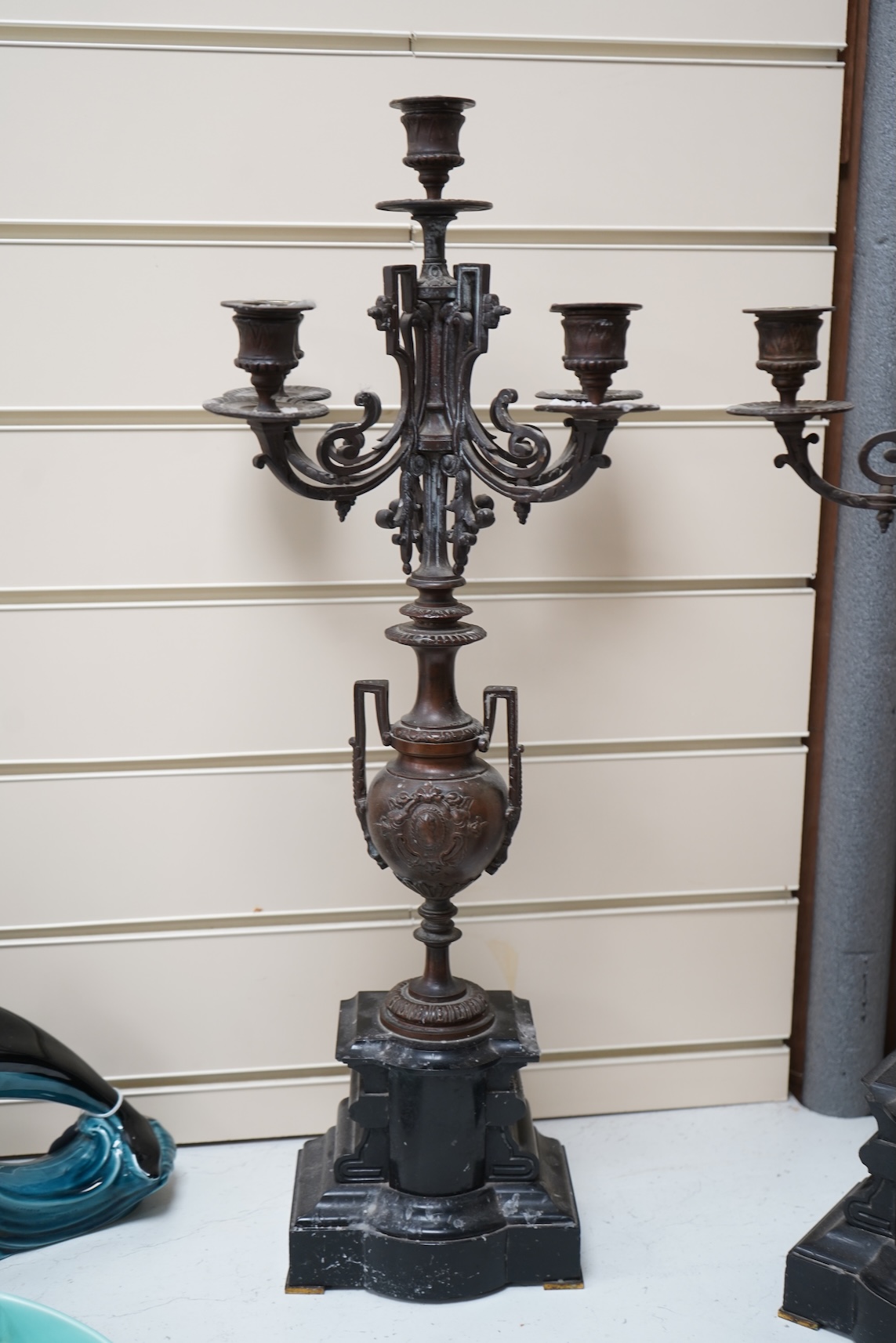 A pair of early 20th century bronze and black slate five light, four branch candelabra, 60cm high